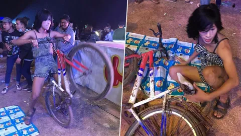 ฮากรามค้าง! หนุ่มแต่งหญิงปั่นจักรยานเต้นหน้าเวทีหมอลำ คนมองกันพรึ่บ (คลิป)