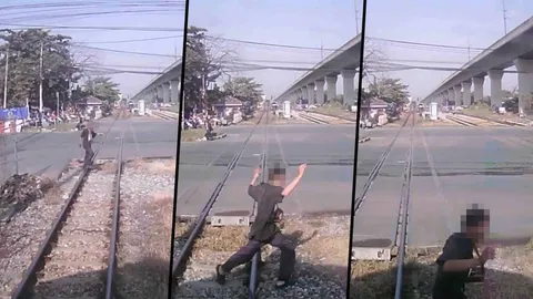 ครั้งหน้าอาจไม่โชคดีแบบนี้! ฉะชายข้ามรางตัดหน้ารถไฟจนเกือบถูกชน (คลิป)