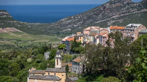 The village nestles among the hills.