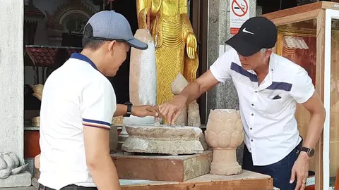 แท่นบูชาโบราณวัดเมืองพะเยา ดูดเหรียญโลหะตั้งตรงได้ คาดเป็นหินแม่เหล็ก (คลิป)