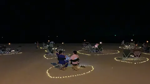 ชาวเน็ตตั้งคำถาม ร้านอาหารตั้งโต๊ะ ประดับไฟ แคมปิ้งริมหาดนาจอมเทียน (คลิป)