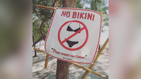 ถกสนั่นโซเชียล ป้ายอ้างวัฒนธรรม ห้ามสวมบิกินีเล่นน้ำ เกาะแสมสาร