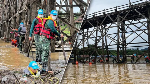 ผวาสะพานมอญพัง น้ำป่าพัดเศษไม้ 200 ตัน ติดตอม่อ ทหารจิตอาสาเร่งปฏิบัติการ (คลิป)