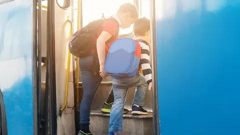 Kids scale buses in this city.