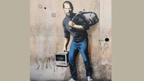 ศิลปินสตรีทอาร์ตเมืองผู้ดีวาดรูป สตีฟ จ็อบส์ หน้าแคมป์ผู้ลี้ภัยเมืองกาเลส์