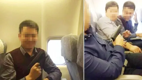 ไม่เข้าท่า! ชาวเน็ตแห่ประณาม หนุ่มจีนเซลฟี่ ถือปืนขู่เพื่อนบนเครื่องบิน