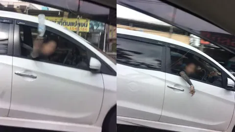 สาวบีบแตรไม่ให้เปลี่ยนเลน เจอหนุ่มหัวร้อนเปิดกระจกปาขวดน้ำใส่ (ชมคลิป)