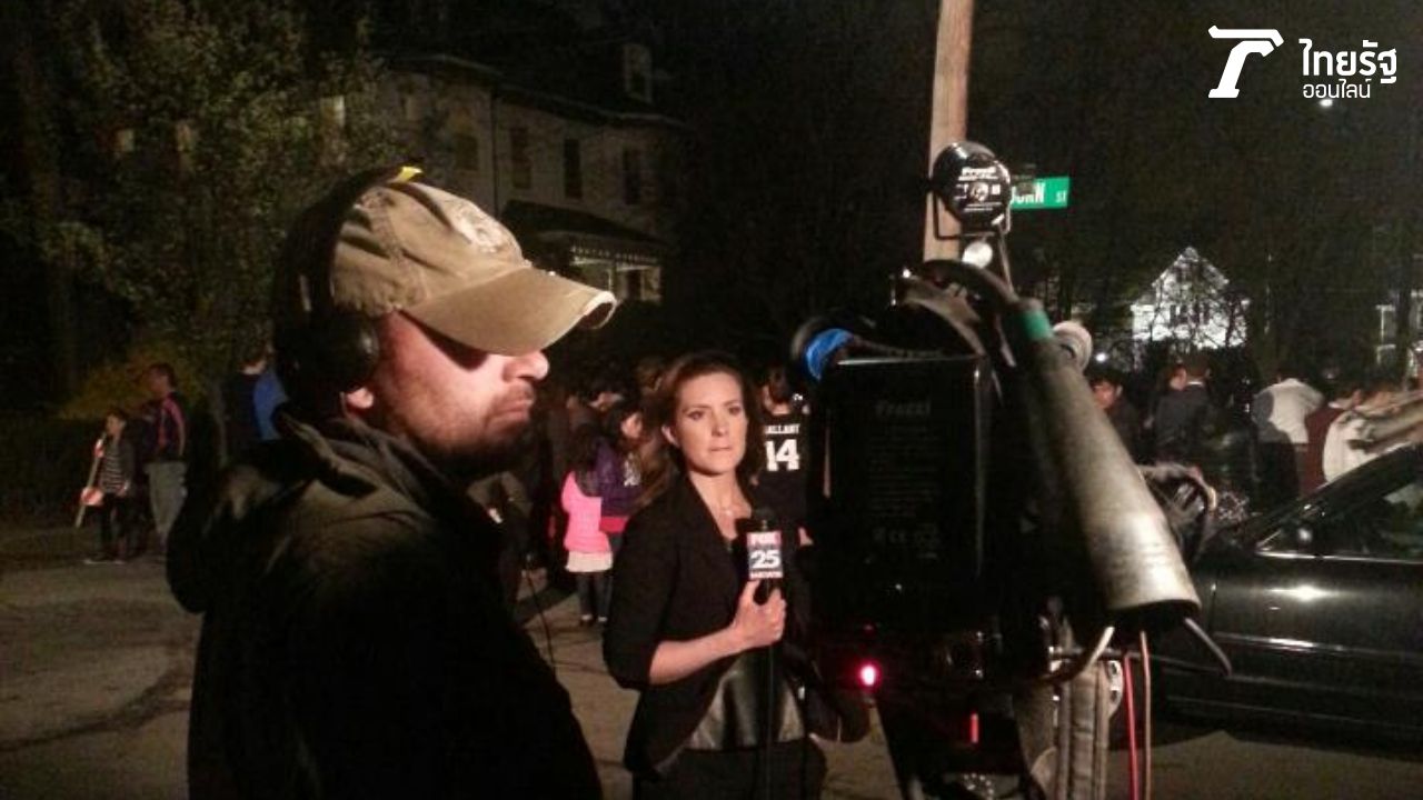 ทีวีท้องถิ่นรายงานหน้าบ้านที่สามารถจับตัวคนร้ายได้ย่าน  Watertown ภาพจากเจ้าของเรื่องถ่ายเอง )