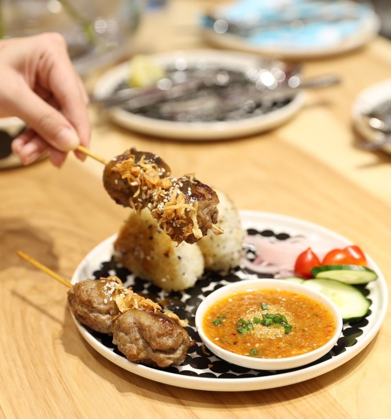 Onigiri with Thai-flavored pork meatballs skewers Moo-Ping โอนิกิริมีทบอลหมูปิ้งสไตล์ไทย