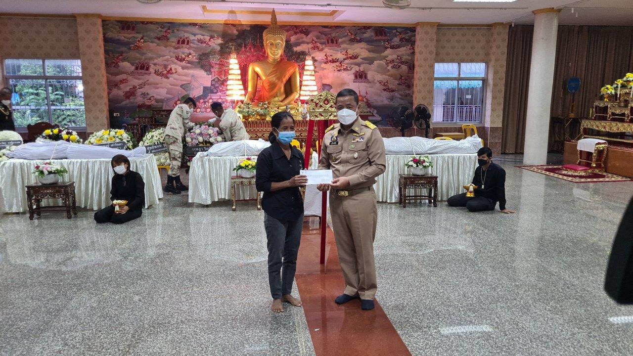 Watering the bodies of 3 railway officials killed in a railway explosion in Songkhla at Khok Samankhun Temple