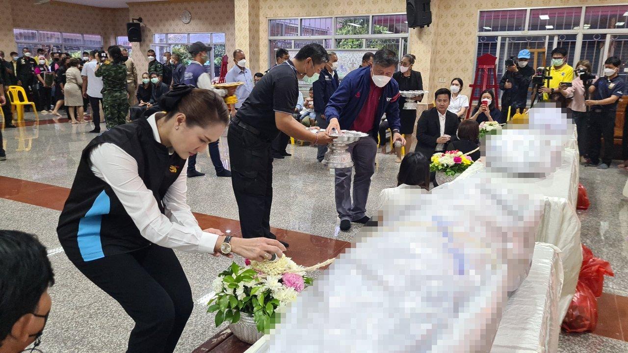 Watering the bodies of 3 railway officials killed in a railway explosion in Songkhla at Khok Samankhun Temple