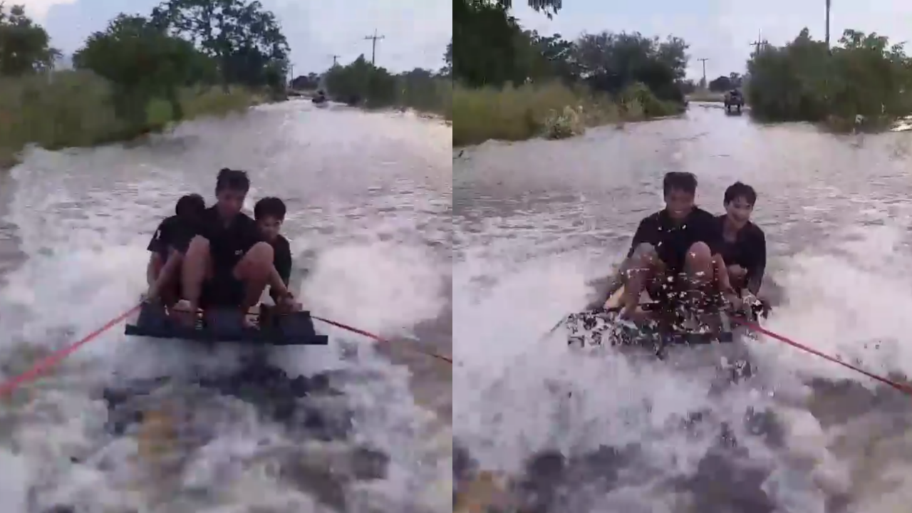 คลายเครียดน้ำท่วม! กลุ่มชายใช้รถลากกระดานโต้คลื่นบนถนนนครสวรรค์