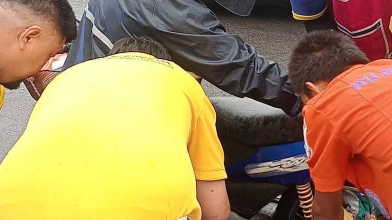 Boy’s left arm trapped in motorcycle wheel due to raincoat