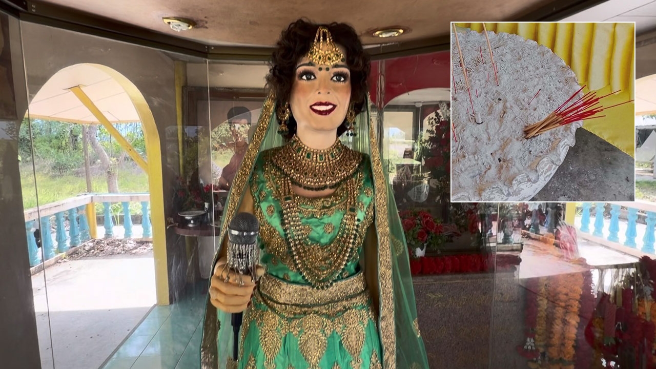 Suspicious Individuals Invert Incense Sticks on Wax Figure at Shrine of Luk Thung Queen Phumphuang Duangchan